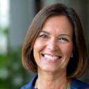 Portrait of Susan R., 52, a smiling professional from Seattle.